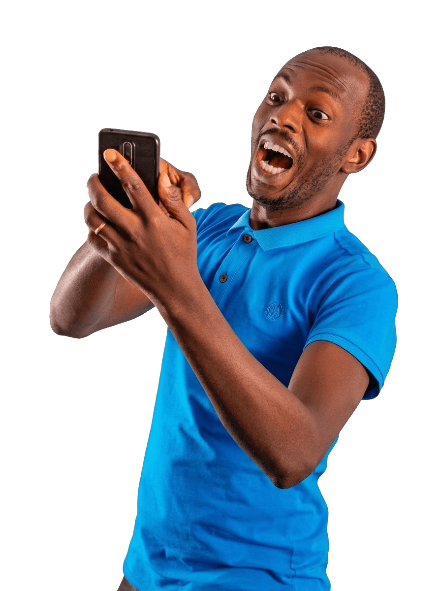 Smiling person celebrating while looking at their phone